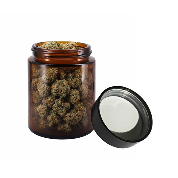 Premium cannabis flower packaging using airtight amber glass jars with child-resistant lids designed to preserve freshness and potency.